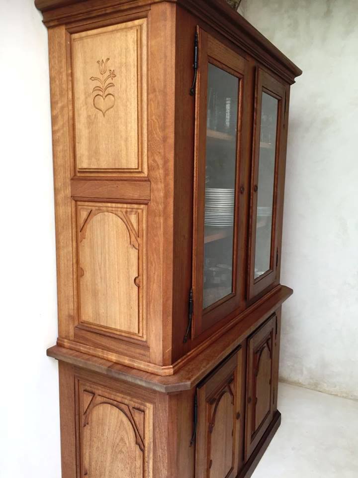 Carved detail and joinery on a handcrafted hardwood cabinet
