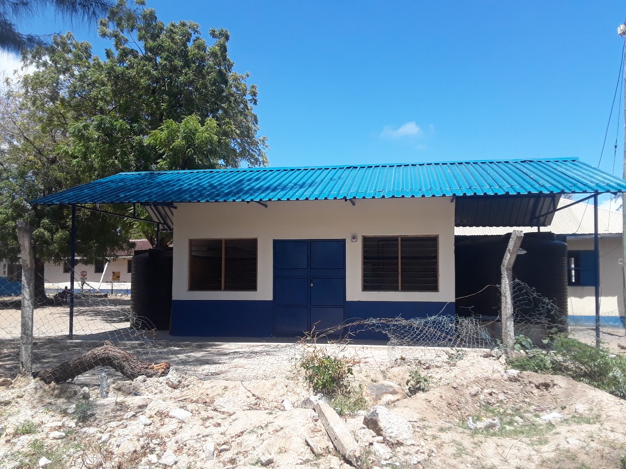 Water treatment building with rainwater storage tanks